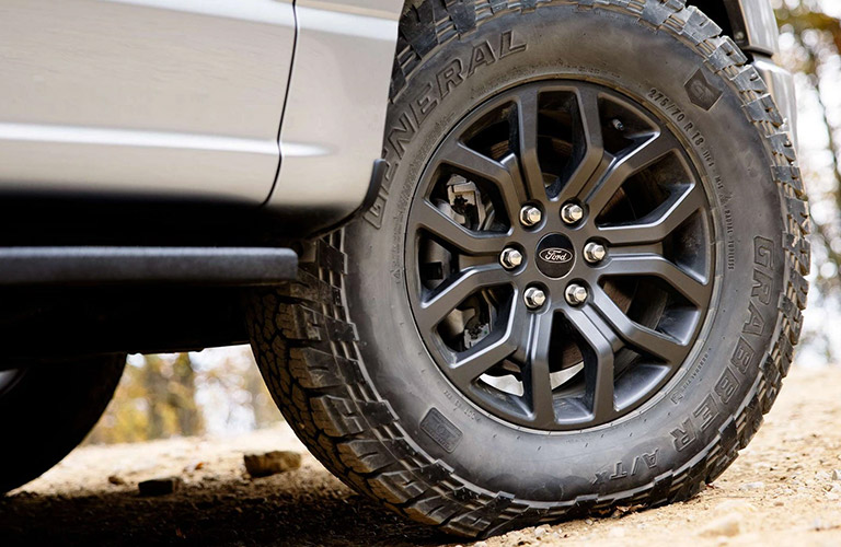 2021 Ford F-150 Tremor wheel and tire on a trail