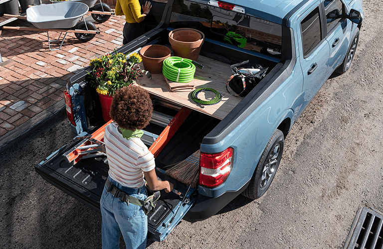 2022 Ford Maverick with people by its bed overhead view