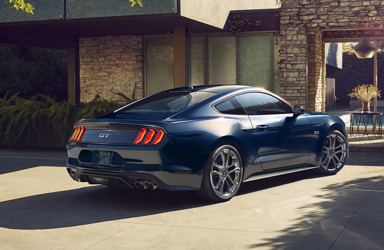 2022 Ford Mustang parked in front of a house