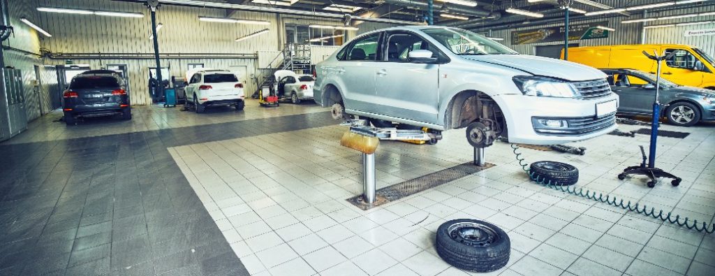 vehicles inside of  a dealership service center