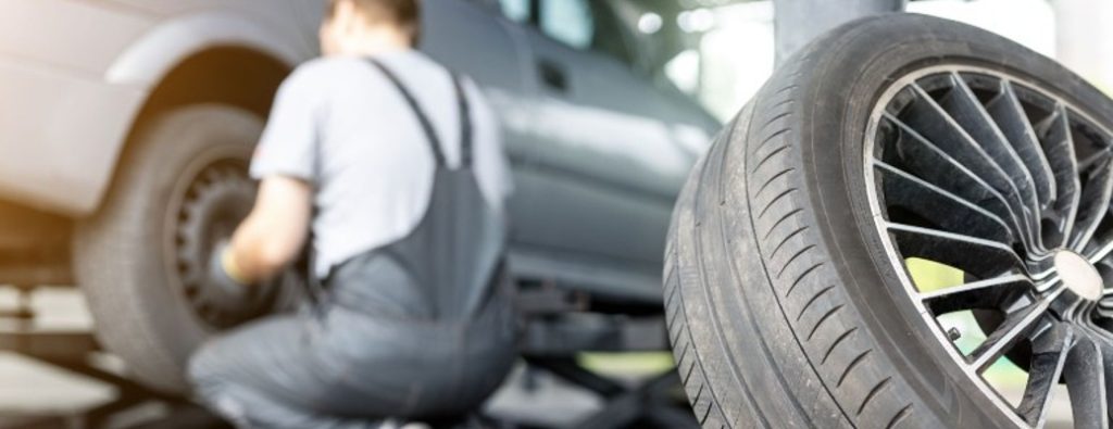 A man changing a car's tire